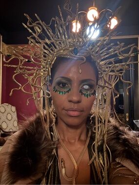 Gold Medusa-Inspired Decorative Headpiece with Emerald Accents